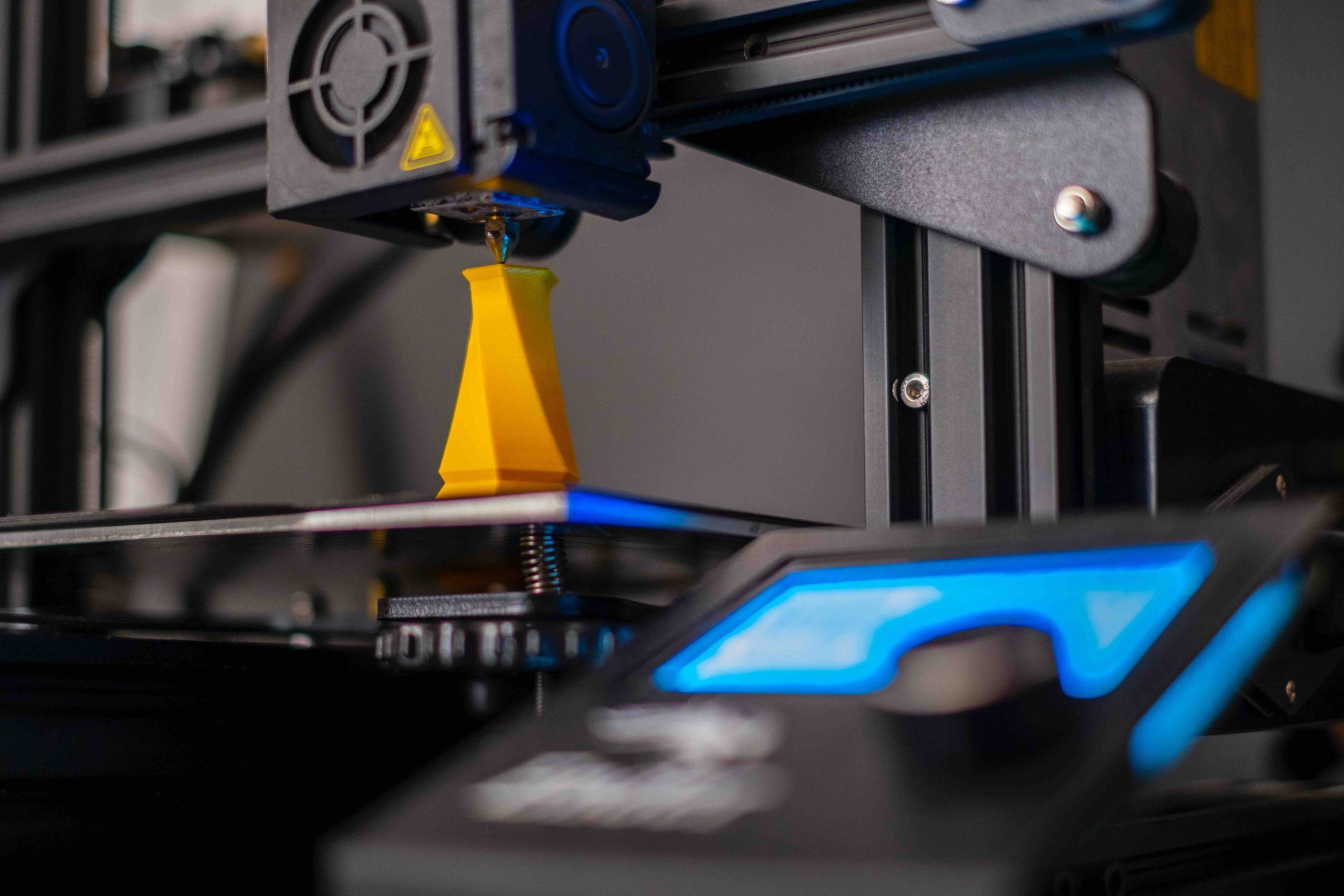 3design coming soon page A 3D printer printing a yellow piece