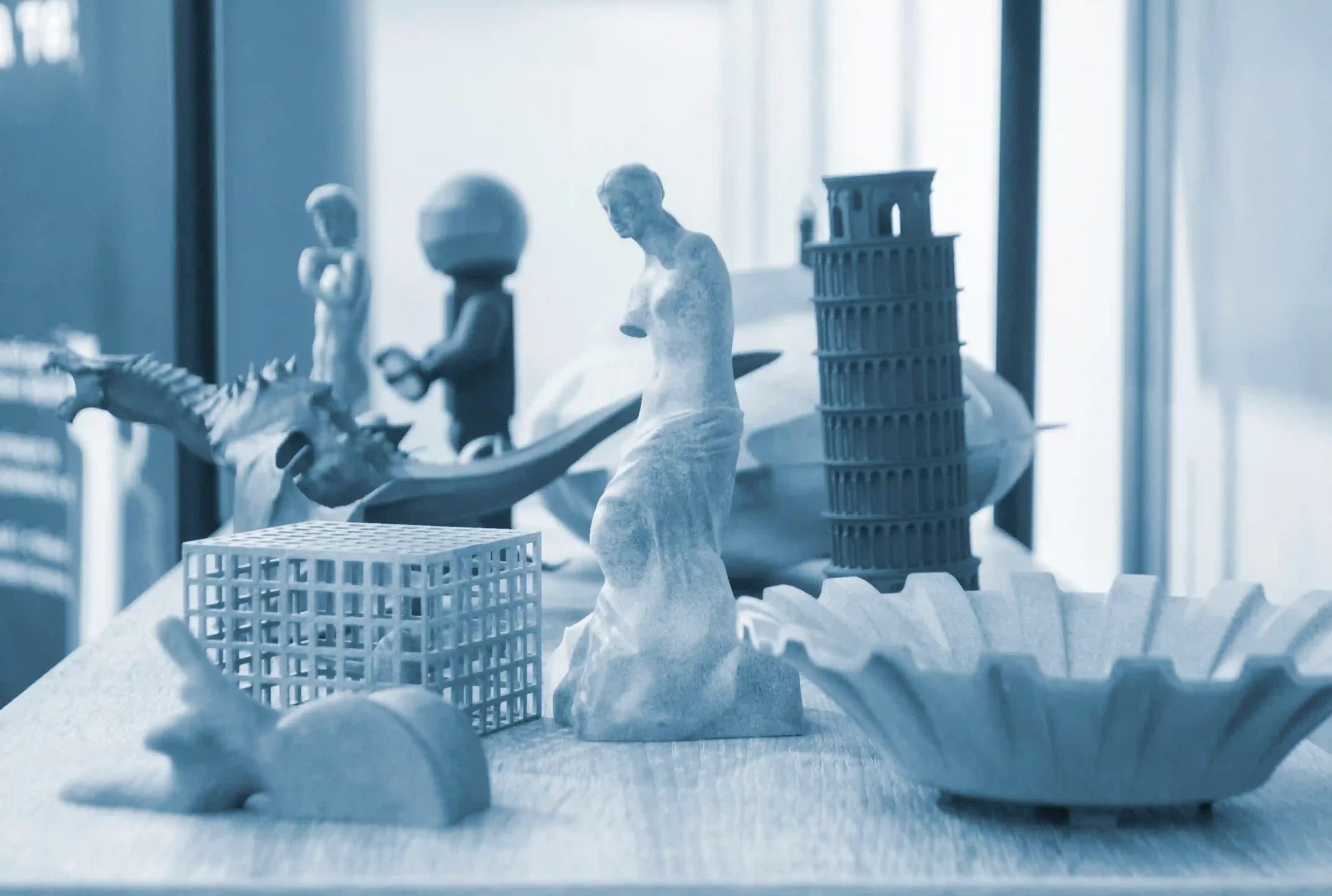 Different 3d-printed objects, they are all printed in grey colour